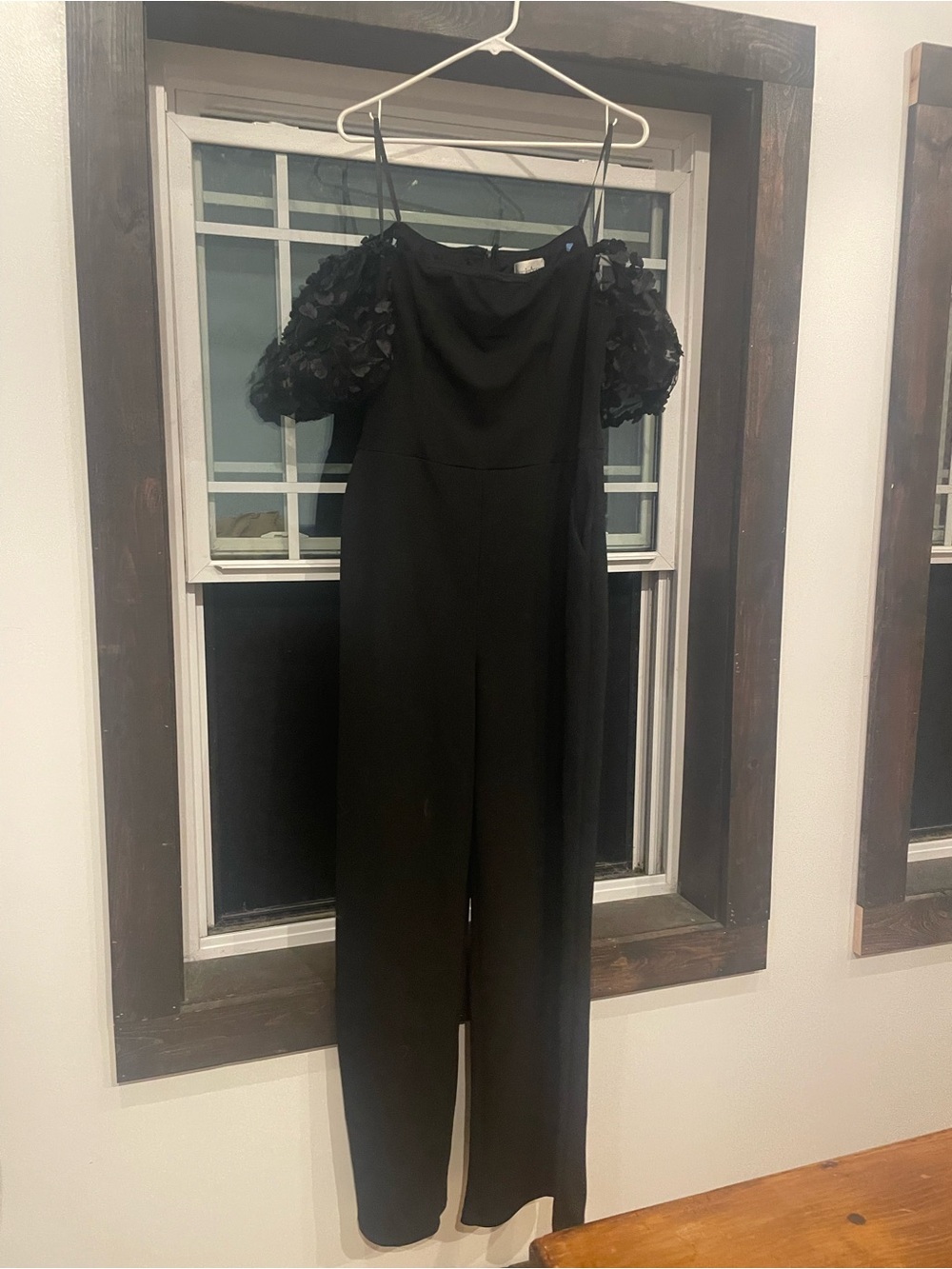 Elegant Black Off-Shoulder Jumpsuit with Floral Puff Sleeves